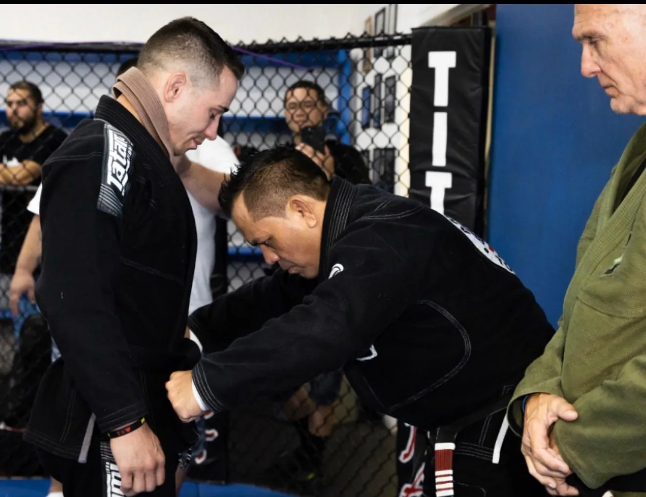 Brazilian Jiu-Jitsu students during a belt promotion ceremony