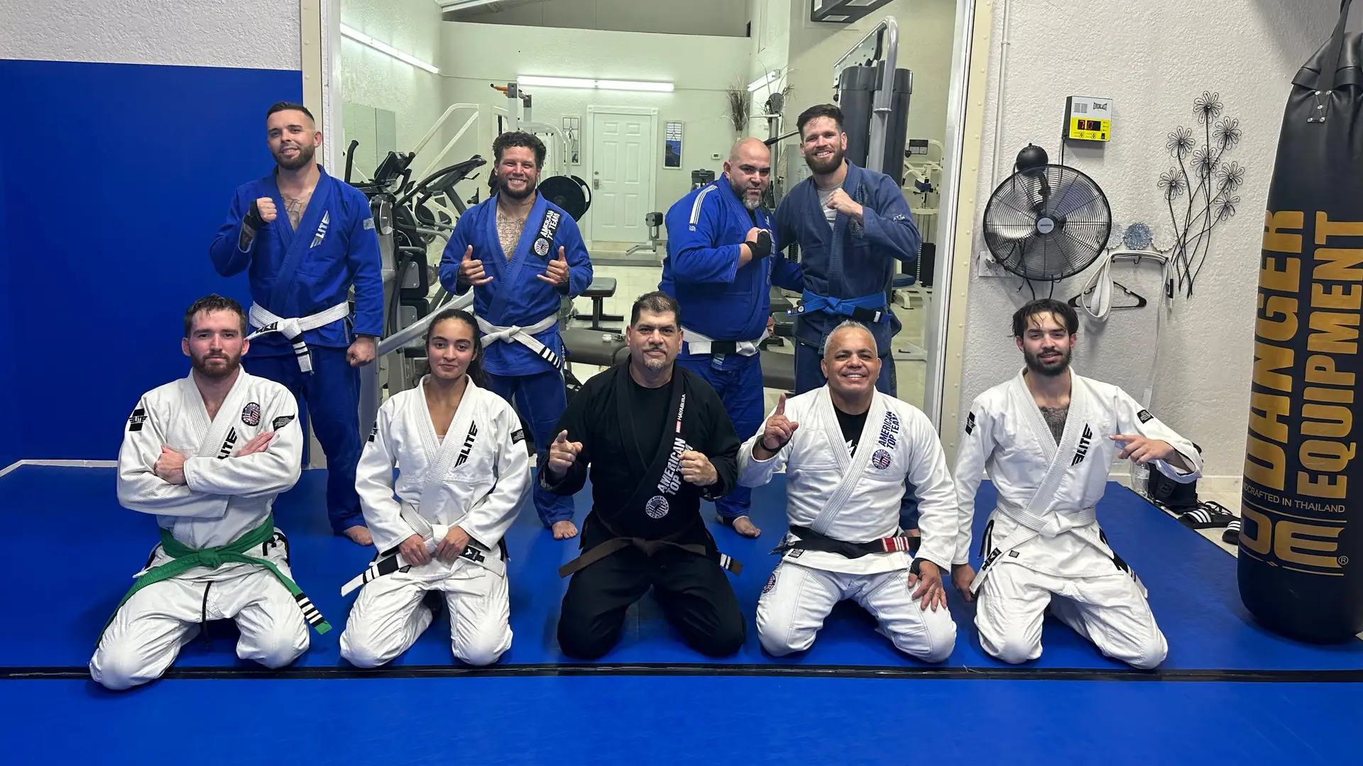 Students in gi training Brazilian Jiu-Jitsu during a class in Fort Myers, FL