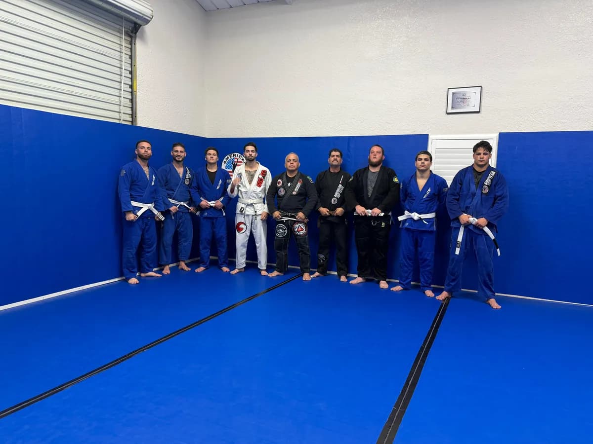 Adult students training Brazilian Jiu-Jitsu in the gi during a class in Fort Myers, FL